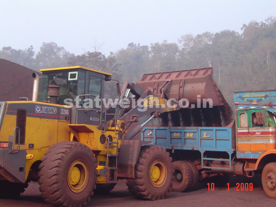 Truck with onboard weighing system